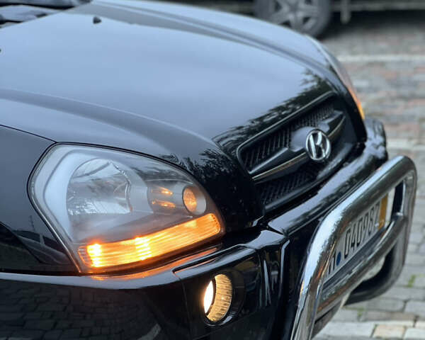 Чорний Хендай Туксон, об'ємом двигуна 1.98 л та пробігом 170 тис. км за 6999 $, фото 56 на Automoto.ua