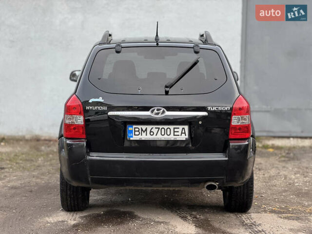 Черный Хендай Туксон, объемом двигателя 1.98 л и пробегом 198 тыс. км за 7500 $, фото 3 на Automoto.ua
