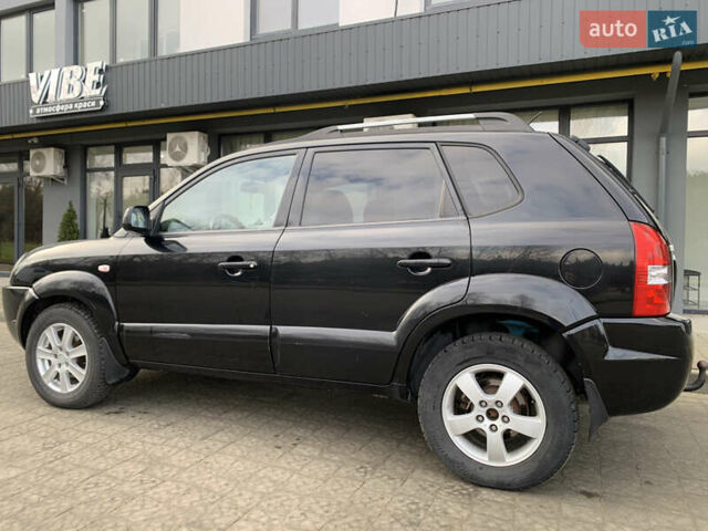 Черный Хендай Туксон, объемом двигателя 1.99 л и пробегом 290 тыс. км за 7700 $, фото 6 на Automoto.ua