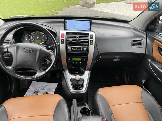 Черный Хендай Туксон, объемом двигателя 2 л и пробегом 216 тыс. км за 7700 $, фото 37 на Automoto.ua