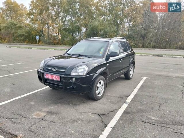 Черный Хендай Туксон, объемом двигателя 2 л и пробегом 127 тыс. км за 7590 $, фото 21 на Automoto.ua