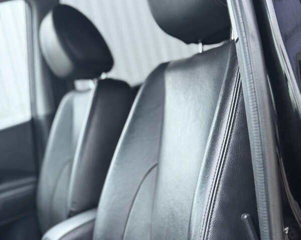 Черный Хендай Туксон, объемом двигателя 1.98 л и пробегом 231 тыс. км за 7750 $, фото 28 на Automoto.ua