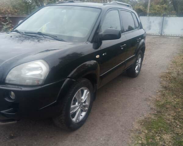 Черный Хендай Туксон, объемом двигателя 2 л и пробегом 231 тыс. км за 8500 $, фото 8 на Automoto.ua