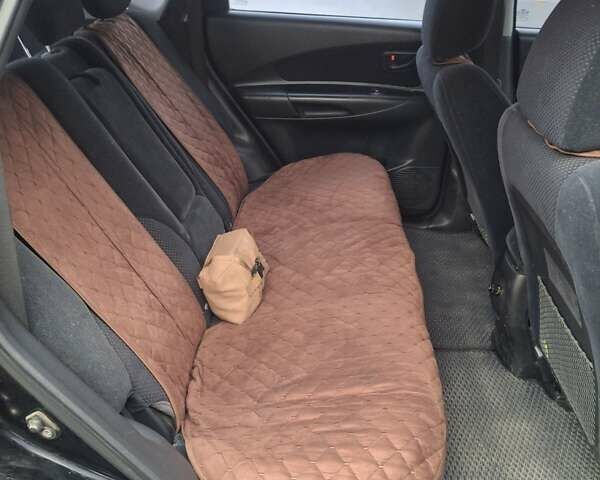 Чорний Хендай Туксон, об'ємом двигуна 2 л та пробігом 270 тис. км за 7500 $, фото 6 на Automoto.ua