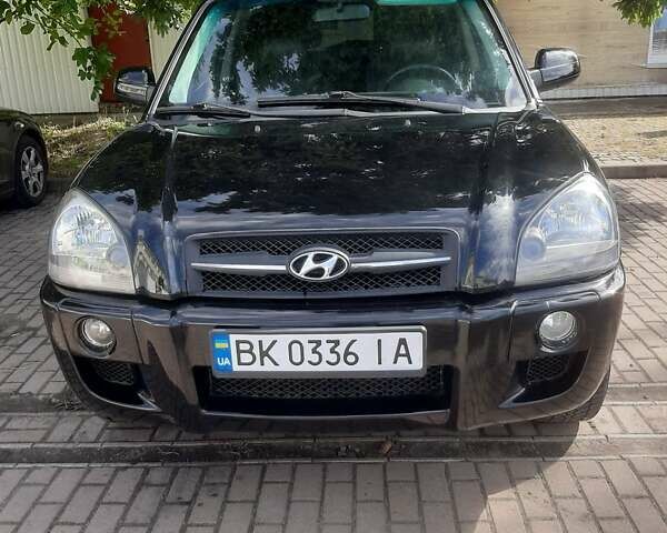Черный Хендай Туксон, объемом двигателя 2 л и пробегом 280 тыс. км за 7400 $, фото 16 на Automoto.ua