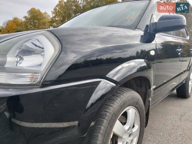Черный Хендай Туксон, объемом двигателя 2 л и пробегом 127 тыс. км за 7590 $, фото 19 на Automoto.ua