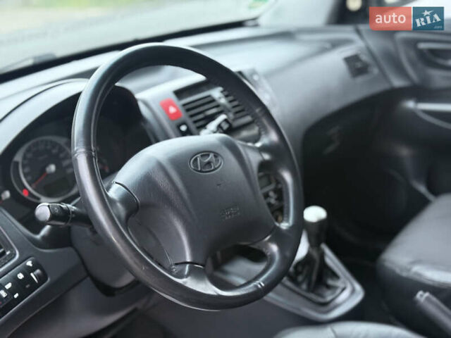 Черный Хендай Туксон, объемом двигателя 1.98 л и пробегом 231 тыс. км за 7750 $, фото 33 на Automoto.ua
