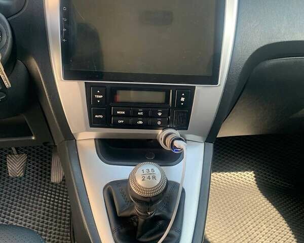 Черный Хендай Туксон, объемом двигателя 1.98 л и пробегом 196 тыс. км за 7700 $, фото 12 на Automoto.ua