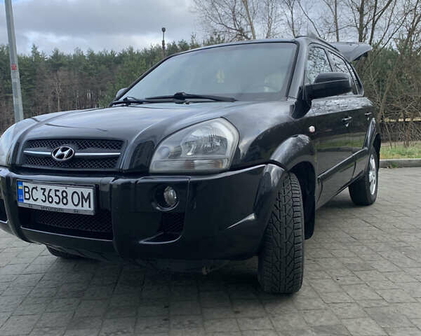 Черный Хендай Туксон, объемом двигателя 1.99 л и пробегом 290 тыс. км за 7700 $, фото 26 на Automoto.ua