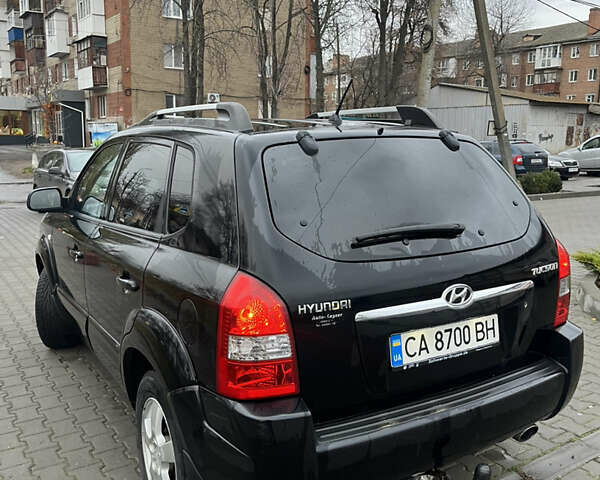 Черный Хендай Туксон, объемом двигателя 2 л и пробегом 242 тыс. км за 6999 $, фото 10 на Automoto.ua