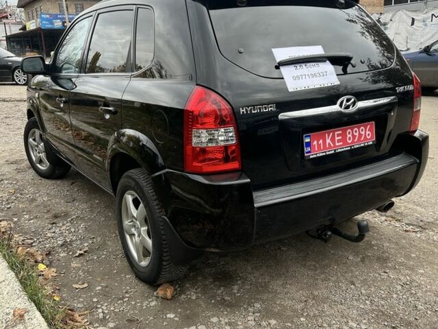 Черный Хендай Туксон, объемом двигателя 2 л и пробегом 159 тыс. км за 8650 $, фото 3 на Automoto.ua