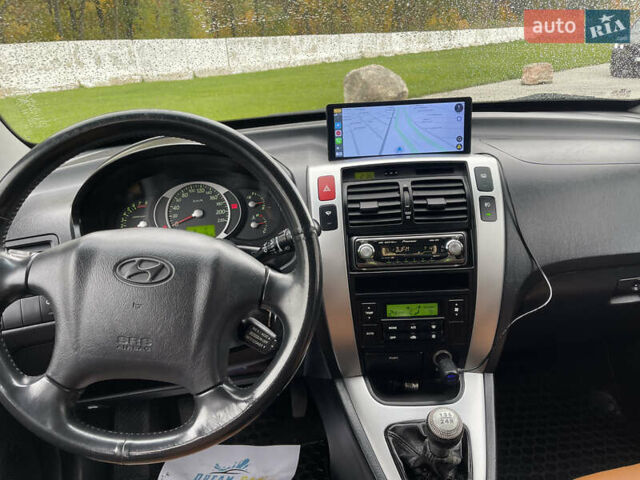 Черный Хендай Туксон, объемом двигателя 2 л и пробегом 216 тыс. км за 7500 $, фото 39 на Automoto.ua