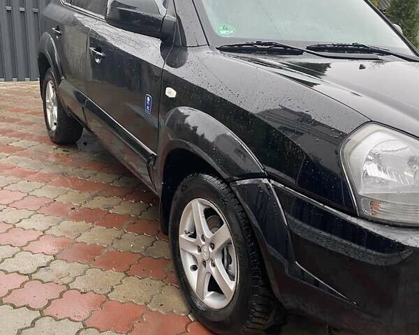 Чорний Хендай Туксон, об'ємом двигуна 1.98 л та пробігом 202 тис. км за 7350 $, фото 1 на Automoto.ua