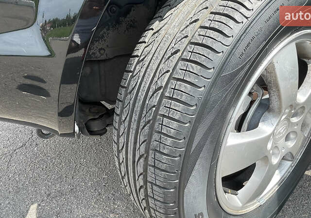 Черный Хендай Туксон, объемом двигателя 2 л и пробегом 236 тыс. км за 6950 $, фото 14 на Automoto.ua