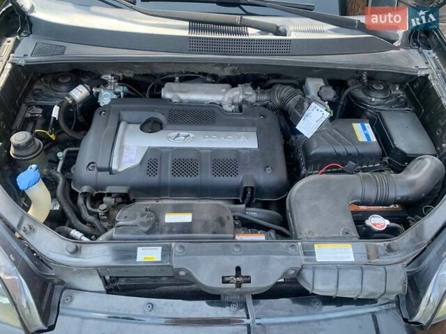 Черный Хендай Туксон, объемом двигателя 1.98 л и пробегом 196 тыс. км за 7700 $, фото 14 на Automoto.ua