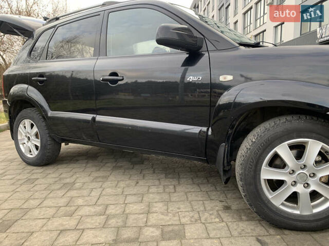 Черный Хендай Туксон, объемом двигателя 1.99 л и пробегом 290 тыс. км за 7700 $, фото 28 на Automoto.ua