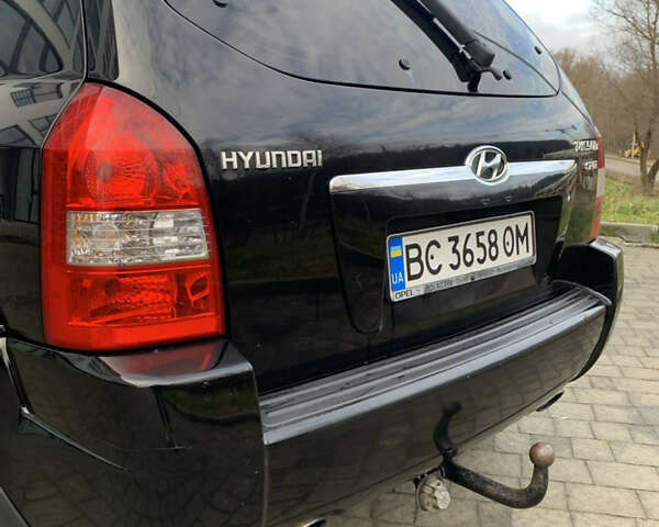 Черный Хендай Туксон, объемом двигателя 1.99 л и пробегом 290 тыс. км за 7700 $, фото 21 на Automoto.ua