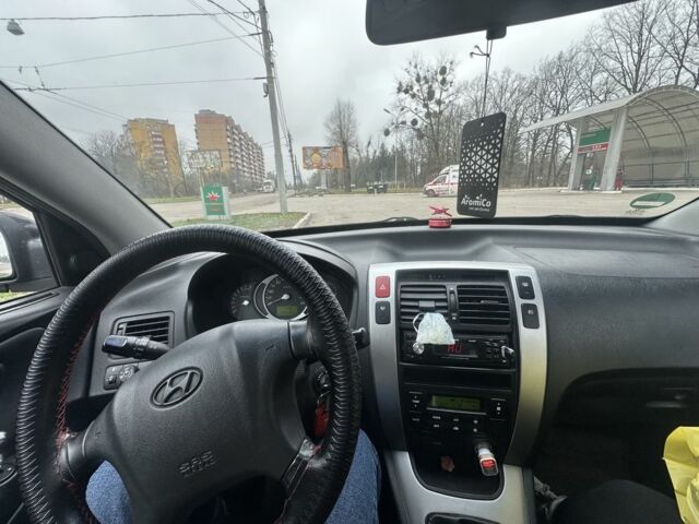 Черный Хендай Туксон, объемом двигателя 2 л и пробегом 174 тыс. км за 8000 $, фото 4 на Automoto.ua