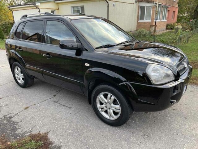 Черный Хендай Туксон, объемом двигателя 2 л и пробегом 163 тыс. км за 7700 $, фото 2 на Automoto.ua