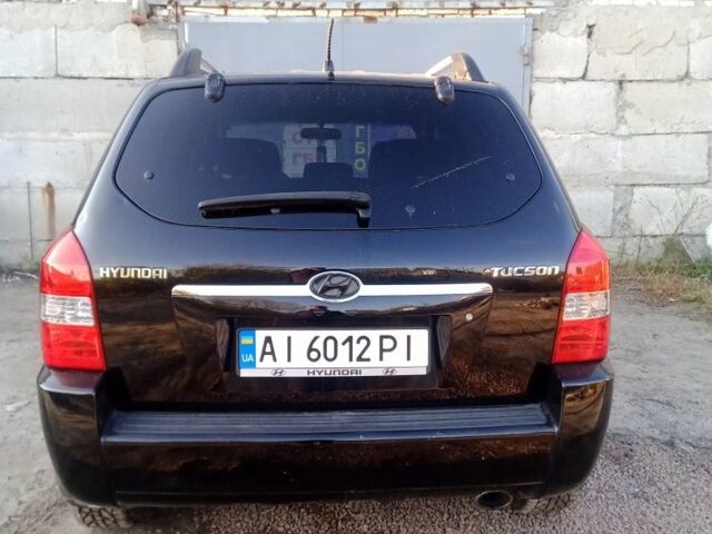 Черный Хендай Туксон, объемом двигателя 2 л и пробегом 203 тыс. км за 7500 $, фото 3 на Automoto.ua