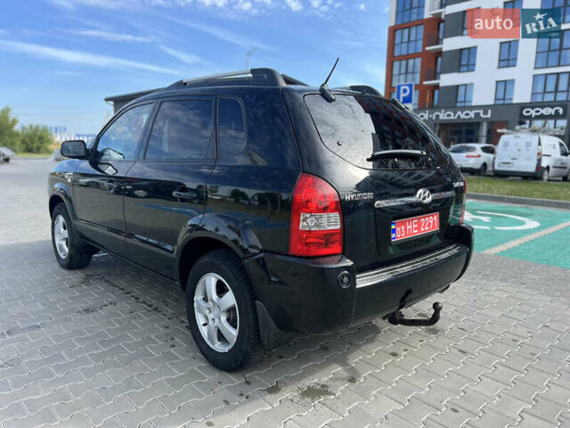 Чорний Хендай Туксон, об'ємом двигуна 2 л та пробігом 237 тис. км за 7650 $, фото 2 на Automoto.ua
