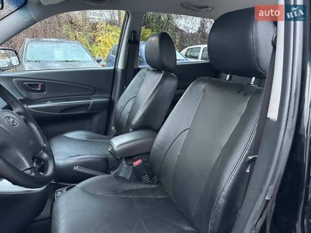 Чорний Хендай Туксон, об'ємом двигуна 2 л та пробігом 167 тис. км за 7950 $, фото 12 на Automoto.ua