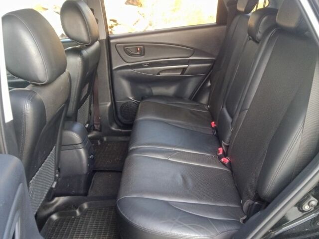 Черный Хендай Туксон, объемом двигателя 2 л и пробегом 203 тыс. км за 7500 $, фото 6 на Automoto.ua