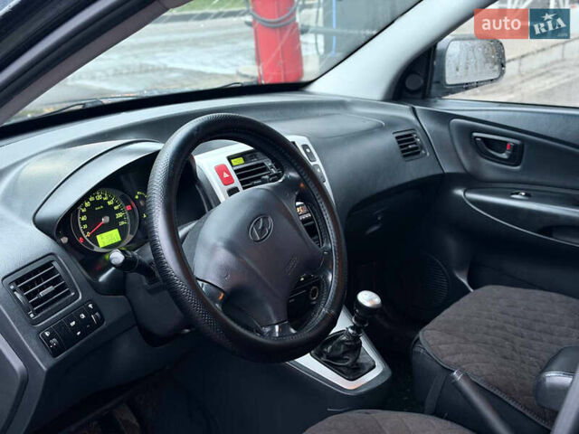 Чорний Хендай Туксон, об'ємом двигуна 1.99 л та пробігом 310 тис. км за 6399 $, фото 17 на Automoto.ua