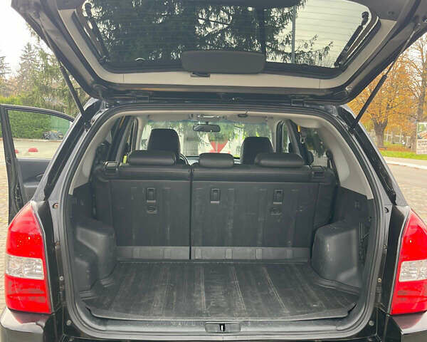 Черный Хендай Туксон, объемом двигателя 1.98 л и пробегом 170 тыс. км за 7750 $, фото 4 на Automoto.ua