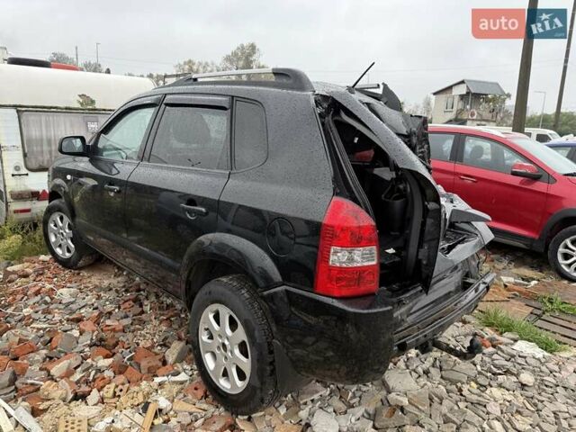 Черный Хендай Туксон, объемом двигателя 2 л и пробегом 151 тыс. км за 3500 $, фото 6 на Automoto.ua