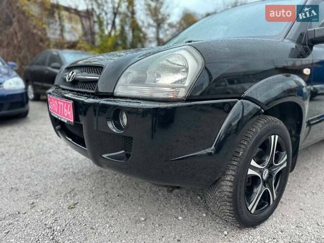 Чорний Хендай Туксон, об'ємом двигуна 2 л та пробігом 167 тис. км за 7950 $, фото 21 на Automoto.ua