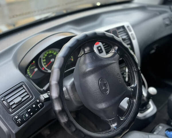 Черный Хендай Туксон, объемом двигателя 2 л и пробегом 242 тыс. км за 6999 $, фото 18 на Automoto.ua