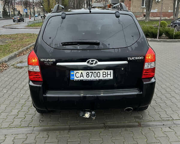 Черный Хендай Туксон, объемом двигателя 2 л и пробегом 242 тыс. км за 6999 $, фото 11 на Automoto.ua