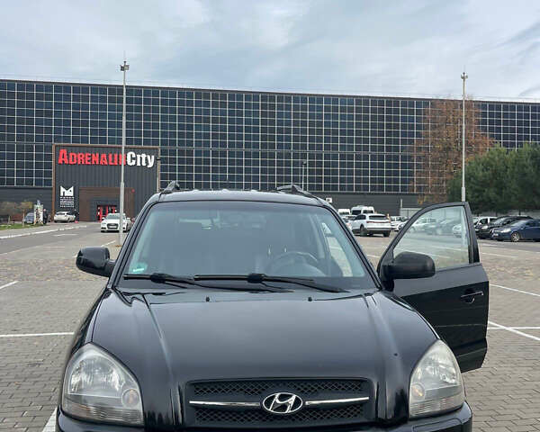 Черный Хендай Туксон, объемом двигателя 1.98 л и пробегом 170 тыс. км за 7750 $, фото 1 на Automoto.ua