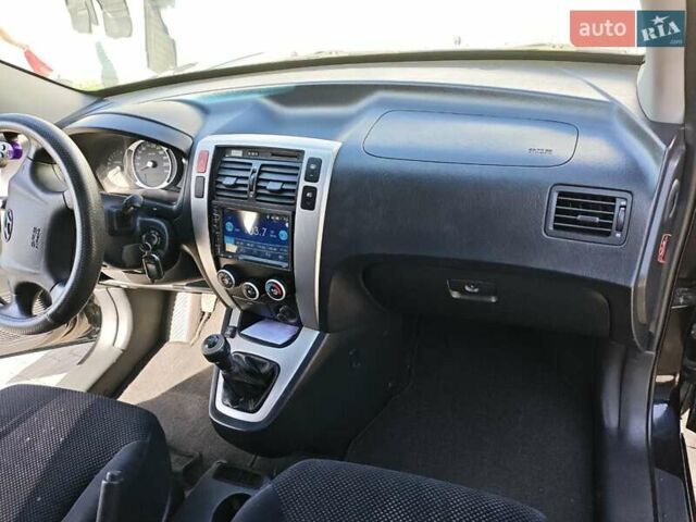 Черный Хендай Туксон, объемом двигателя 2 л и пробегом 247 тыс. км за 6300 $, фото 1 на Automoto.ua