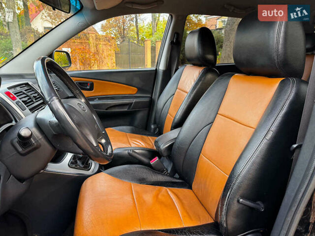 Черный Хендай Туксон, объемом двигателя 2 л и пробегом 210 тыс. км за 7990 $, фото 22 на Automoto.ua