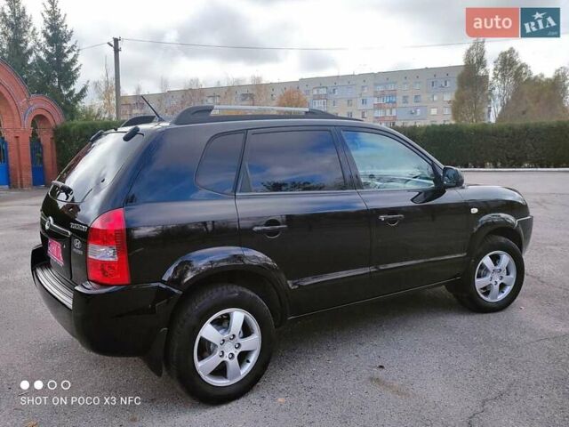 Черный Хендай Туксон, объемом двигателя 2 л и пробегом 237 тыс. км за 7999 $, фото 7 на Automoto.ua