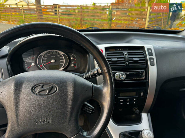 Черный Хендай Туксон, объемом двигателя 2 л и пробегом 210 тыс. км за 7990 $, фото 21 на Automoto.ua