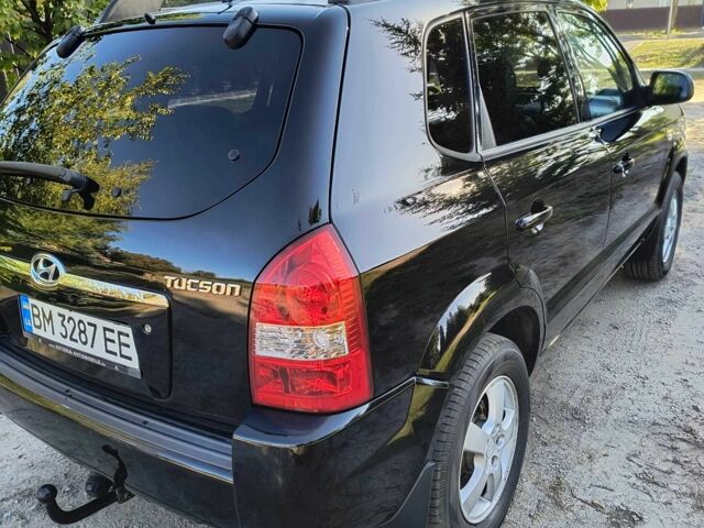 Черный Хендай Туксон, объемом двигателя 2 л и пробегом 206 тыс. км за 7500 $, фото 5 на Automoto.ua