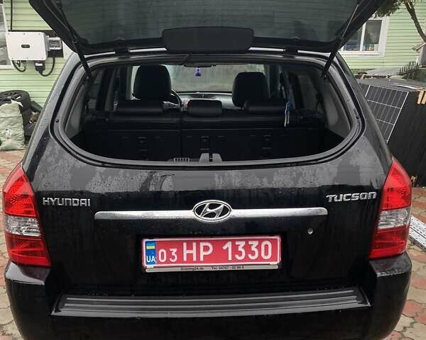 Чорний Хендай Туксон, об'ємом двигуна 1.98 л та пробігом 202 тис. км за 7350 $, фото 9 на Automoto.ua