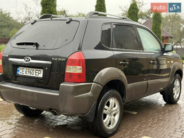 Черный Хендай Туксон, объемом двигателя 2 л и пробегом 256 тыс. км за 7450 $, фото 6 на Automoto.ua