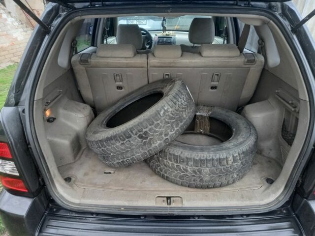 Черный Хендай Туксон, объемом двигателя 2 л и пробегом 395 тыс. км за 4500 $, фото 4 на Automoto.ua