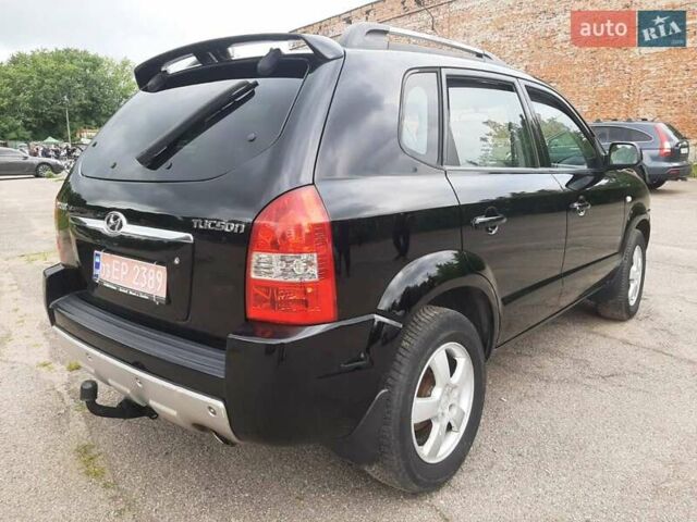Черный Хендай Туксон, объемом двигателя 2 л и пробегом 216 тыс. км за 7600 $, фото 7 на Automoto.ua