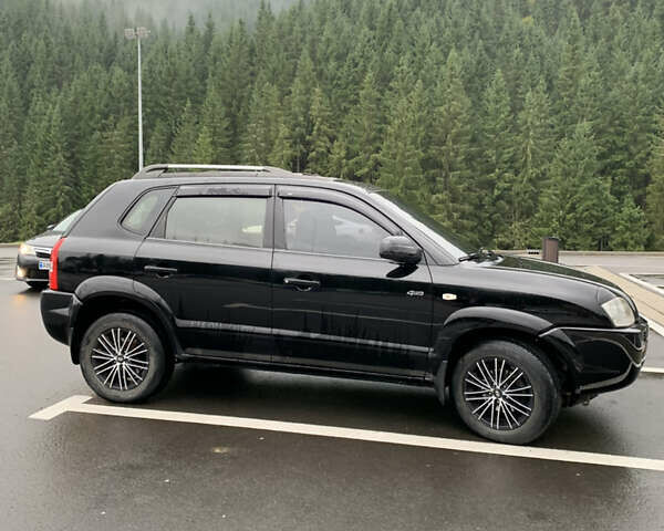 Черный Хендай Туксон, объемом двигателя 2 л и пробегом 277 тыс. км за 7900 $, фото 5 на Automoto.ua