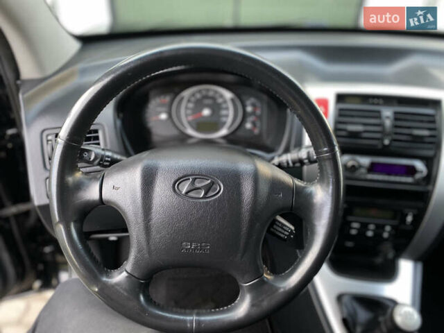 Чорний Хендай Туксон, об'ємом двигуна 1.98 л та пробігом 233 тис. км за 7650 $, фото 53 на Automoto.ua