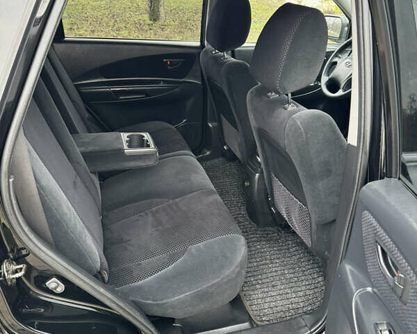Черный Хендай Туксон, объемом двигателя 2 л и пробегом 201 тыс. км за 7750 $, фото 52 на Automoto.ua