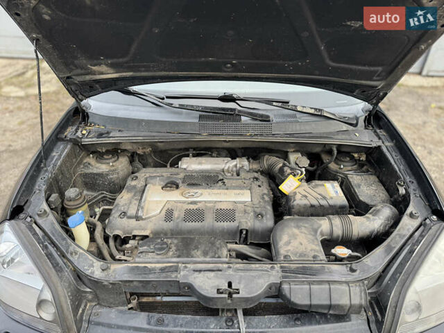 Черный Хендай Туксон, объемом двигателя 1.98 л и пробегом 198 тыс. км за 7500 $, фото 18 на Automoto.ua