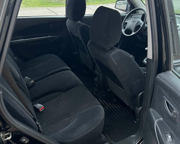 Черный Хендай Туксон, объемом двигателя 1.98 л и пробегом 227 тыс. км за 6900 $, фото 26 на Automoto.ua