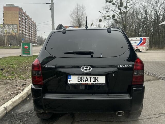 Черный Хендай Туксон, объемом двигателя 2 л и пробегом 174 тыс. км за 8000 $, фото 1 на Automoto.ua