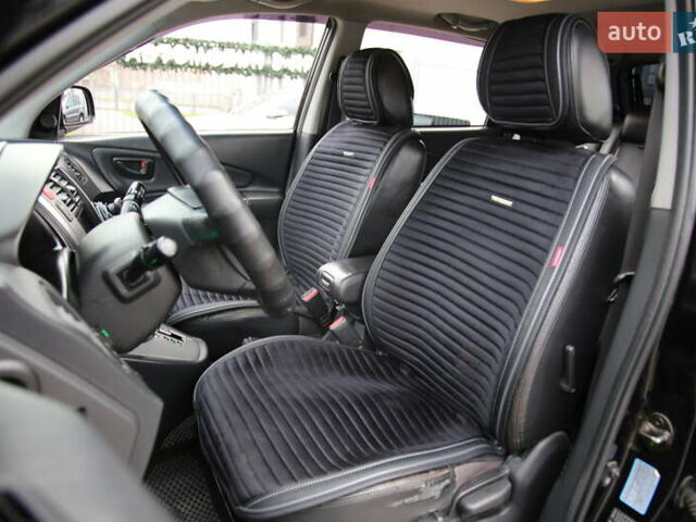 Черный Хендай Туксон, объемом двигателя 2.66 л и пробегом 217 тыс. км за 8600 $, фото 6 на Automoto.ua